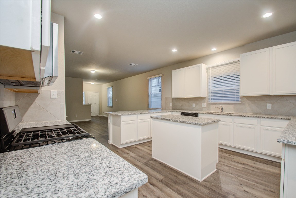 3620 Cub Drive Conroe, TX 77301 - Photo 10 of 49 a kitchen with a sink stove and cabinets