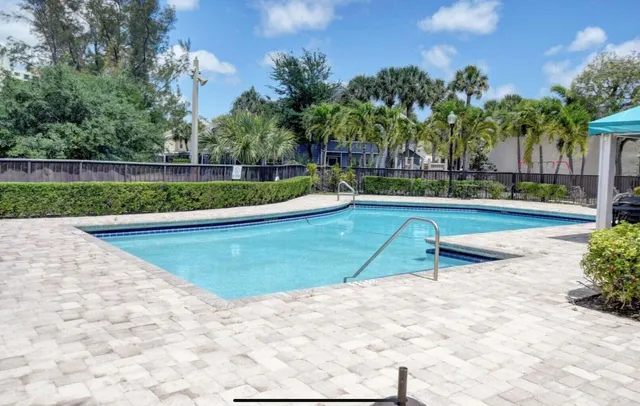 a view of swimming pool with a patio