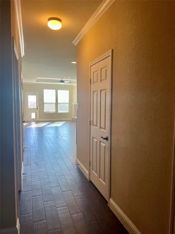 a living room with hard wood floors and a fireplace