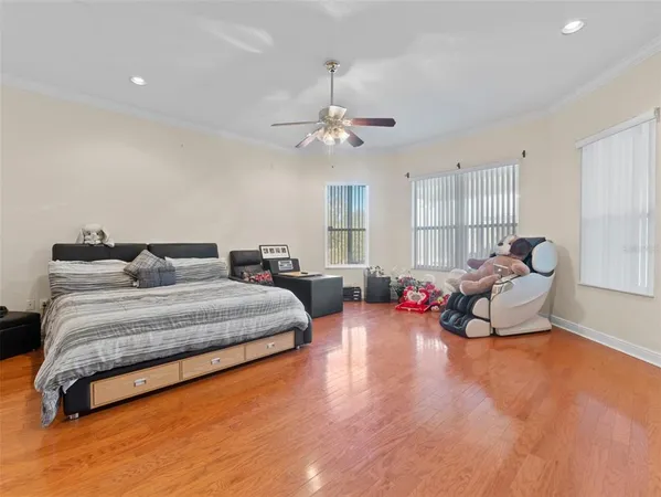 a spacious bedroom with a bed and a couch