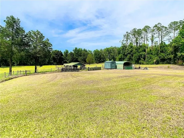 a view of a swimming pool with an outdoor space and seating area