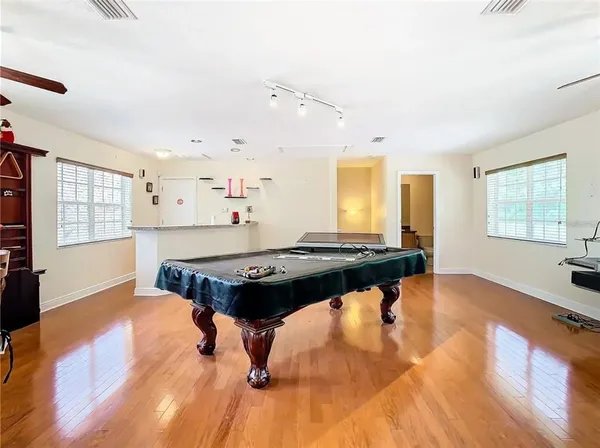 a living room with hard wood floors and a couch