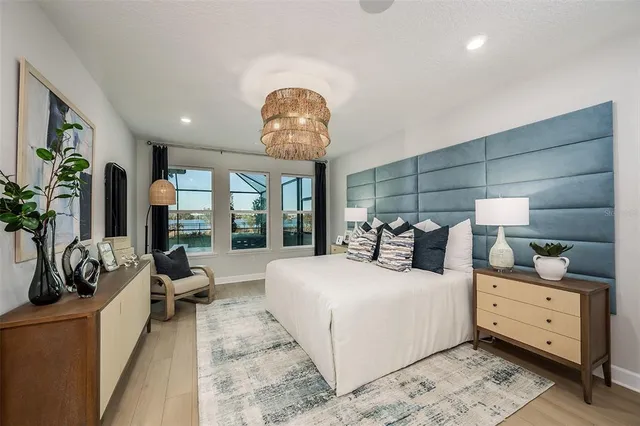 a bed room with a bed and a large mirror