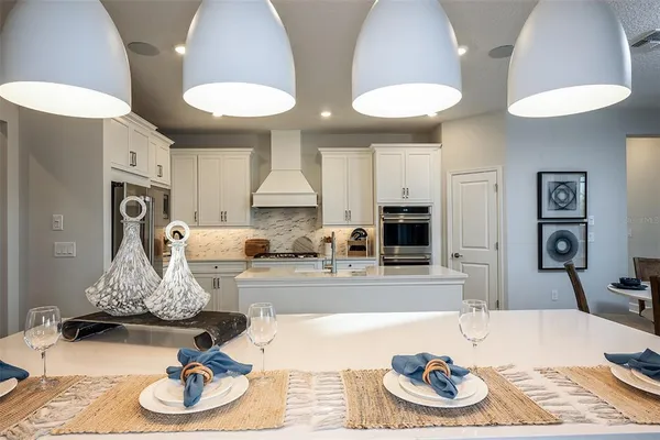 a kitchen with furniture and a kitchen view