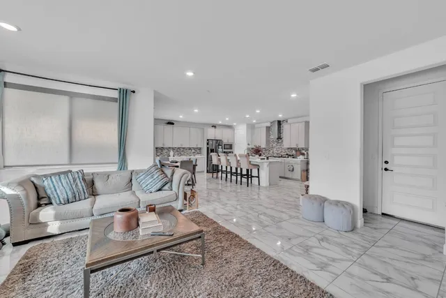 a living room with furniture and a table