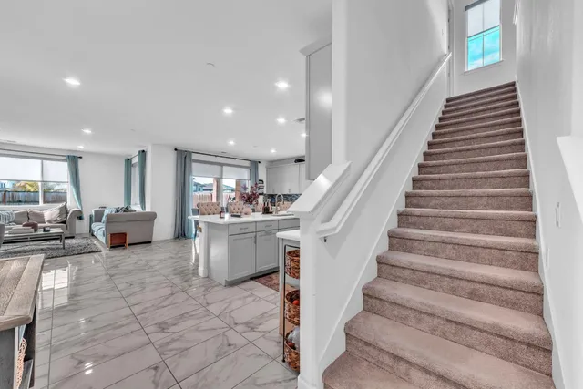 a view of a living room and entryway