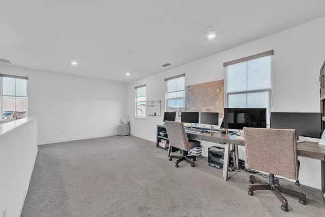 a view of a workspace with furniture