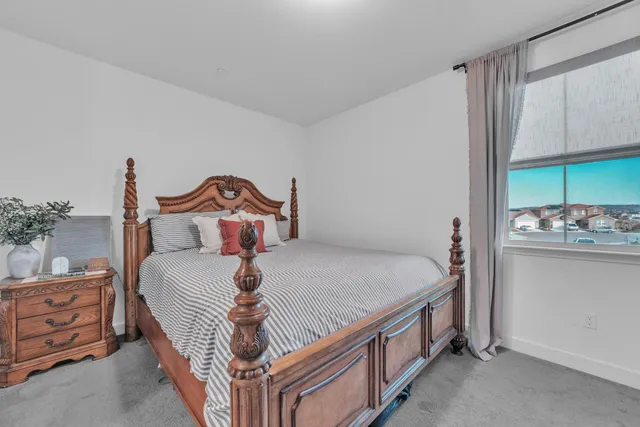 a bedroom with a bed and a cabinets