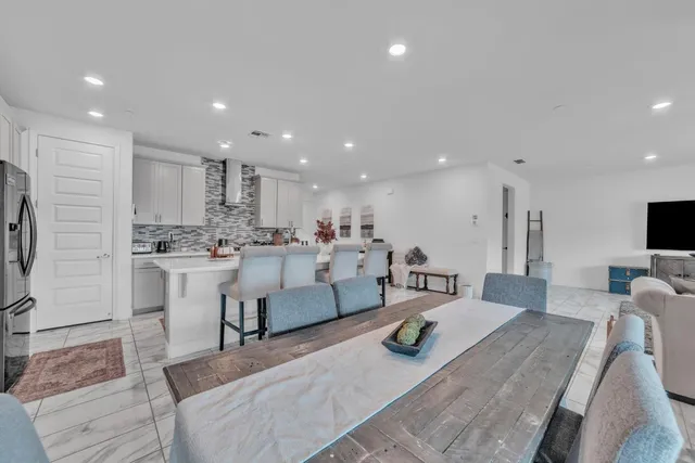 a living room with kitchen island furniture and a view of living room