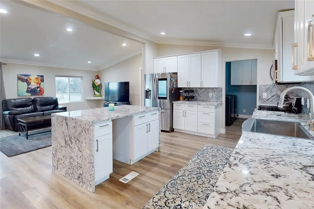 3453 La Porte Road Oroville, CA 95966 - Photo 21 of 69 a kitchen with stainless steel appliances granite countertop a sink stove and refrigerator