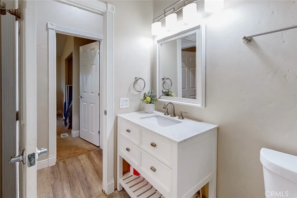 3453 La Porte Road Oroville, CA 95966 - Photo 31 of 69 a bathroom with a sink a toilet and mirror