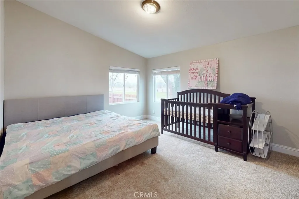 3453 La Porte Road Oroville, CA 95966 - Photo 32 of 69 a bedroom with a bed and a lamp