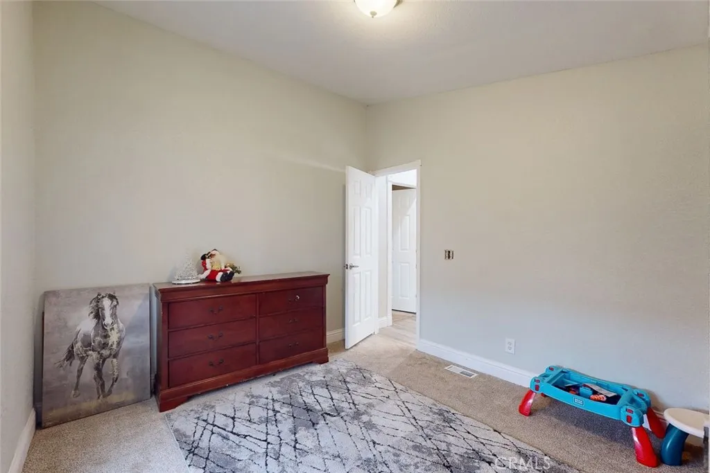 3453 La Porte Road Oroville, CA 95966 - Photo 34 of 69 a bedroom with a bed and a dresser