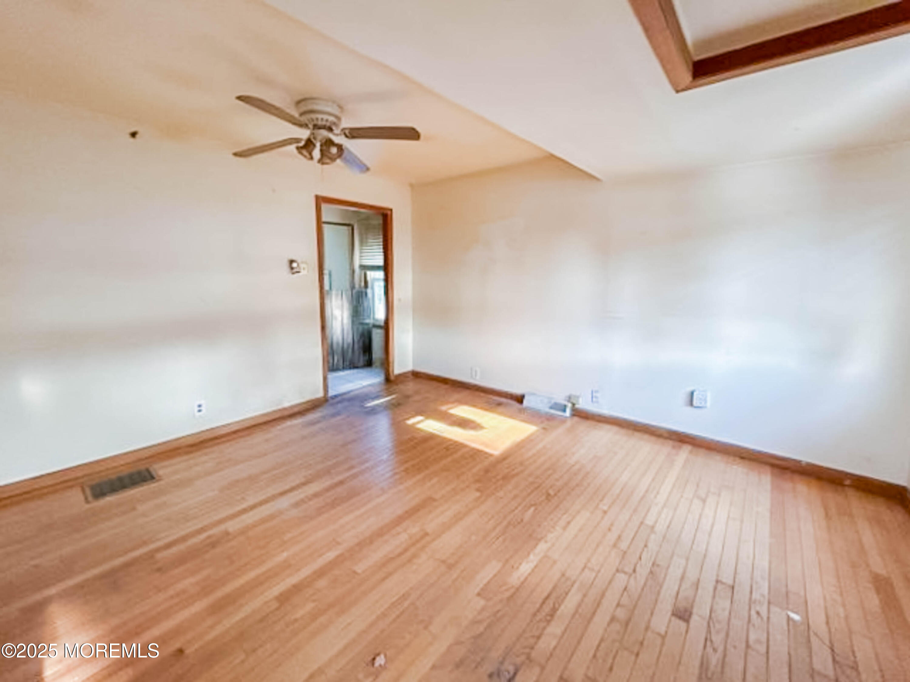 58 Manalapan Road Spotswood, NJ 08884 - Photo 5 of 22 wooden floor in an empty room