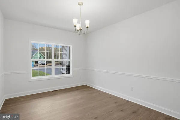 an empty room with a chandelier