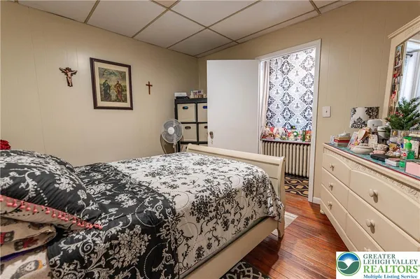 a bedroom with bed and window