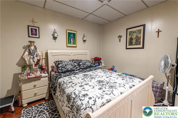 a bed room with a bed and a dresser