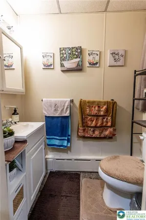 a kitchen with stainless steel appliances a cabinets and window