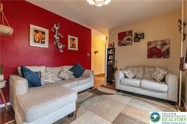 a living room with furniture and a couch