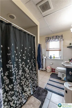 a living room with a couch and a window