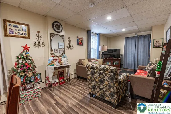 a living room with furniture and a flat screen tv