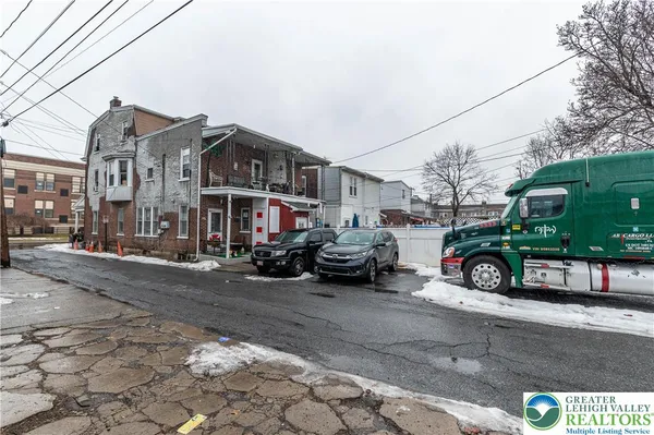 a view of a street with cars