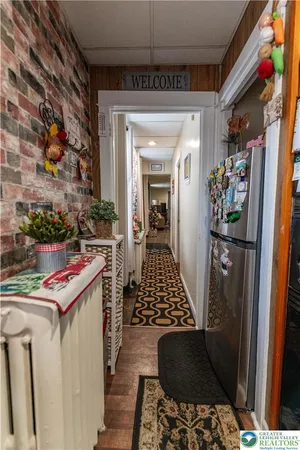 a kitchen with a refrigerator and a stove