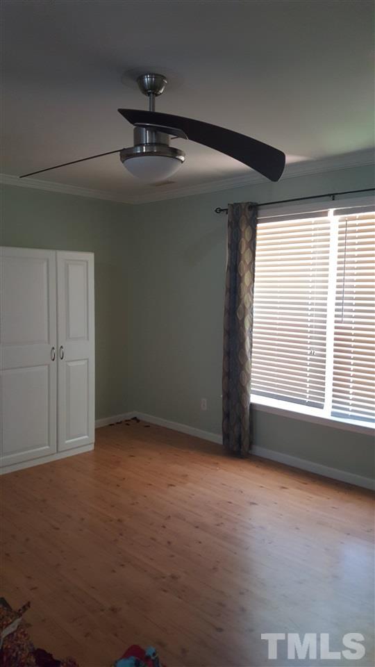 304 Dirgie Mine Road Roxboro, NC 27574 - Photo 22 of 25 an empty room with a ceiling fan and window
