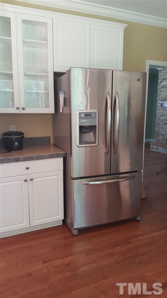 304 Dirgie Mine Road Roxboro, NC 27574 - Photo 5 of 25 a white refrigerator freezer sitting in a kitchen