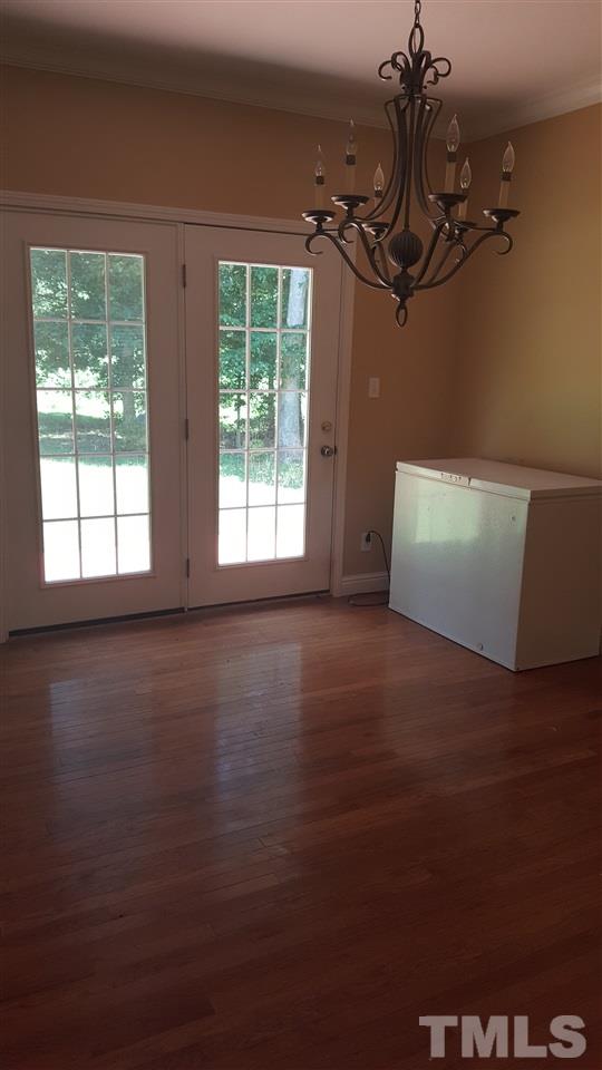 304 Dirgie Mine Road Roxboro, NC 27574 - Photo 8 of 25 a view of empty room with wooden floor and fan