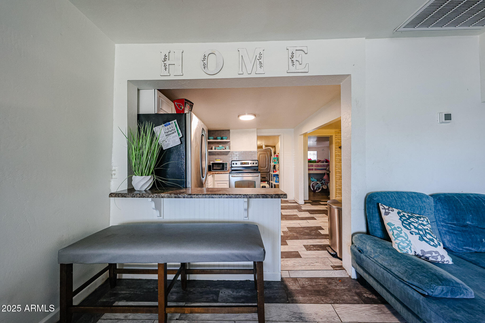 8223 C. Azteca Guadalupe, AZ 85283 - Photo 5 of 24 a living room with furniture and a fireplace