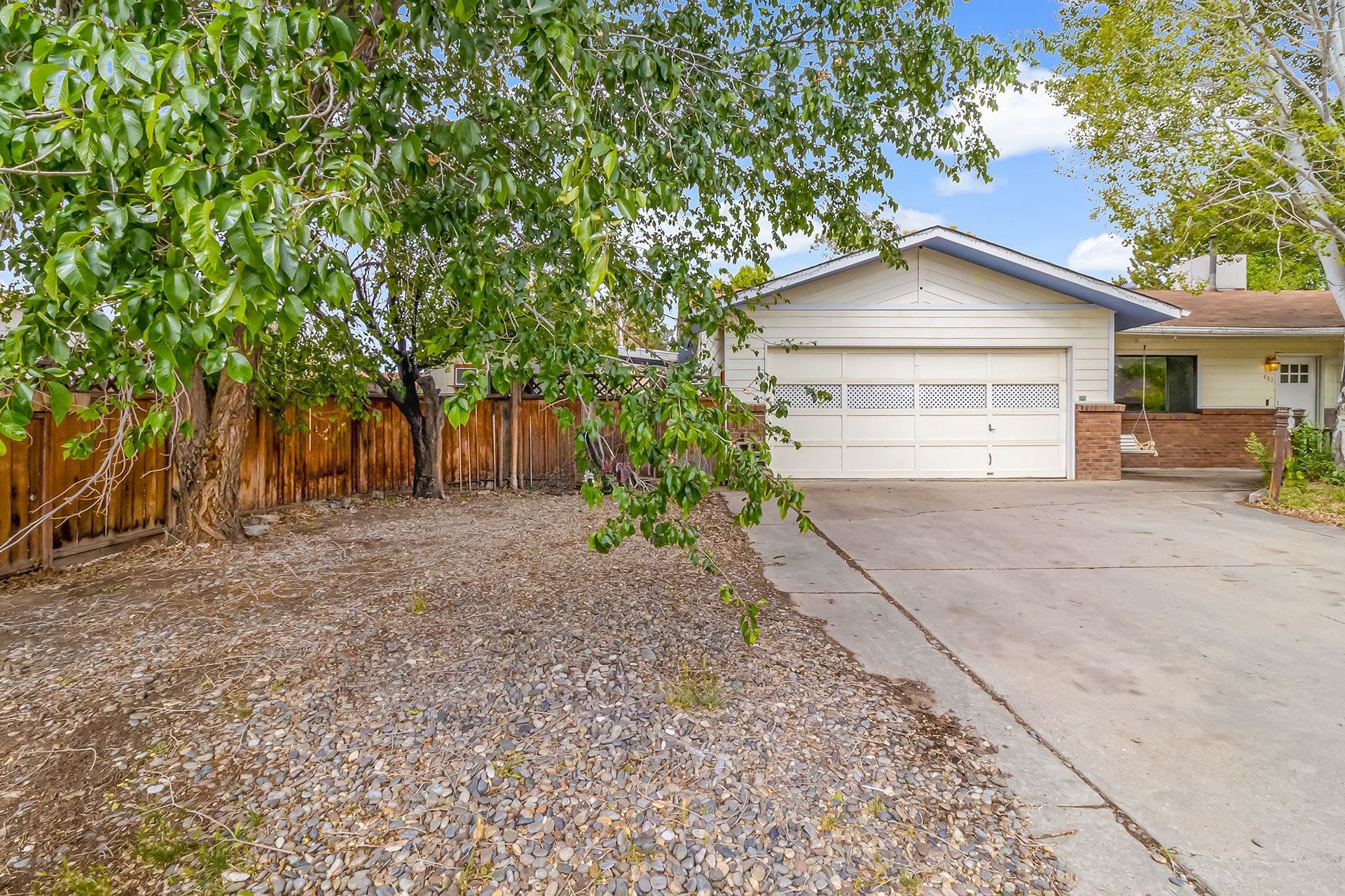 483-30 C 3/4 Road Grand Junction, CO 81504 - Photo 23 of 25 a front view of a house with a yard and garage