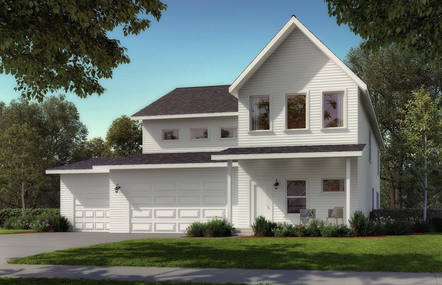 a front view of a house with a garden and plants