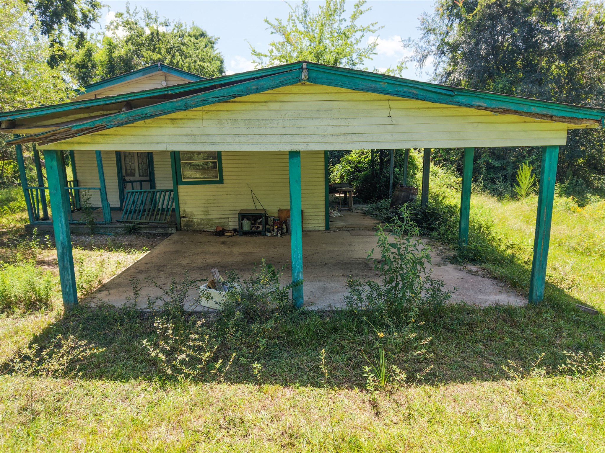 28619 Barry Lane Waller, TX 77484 - Photo 17 of 28 Attached covered carport provides convenient sheltered parking and additional outdoor workspace