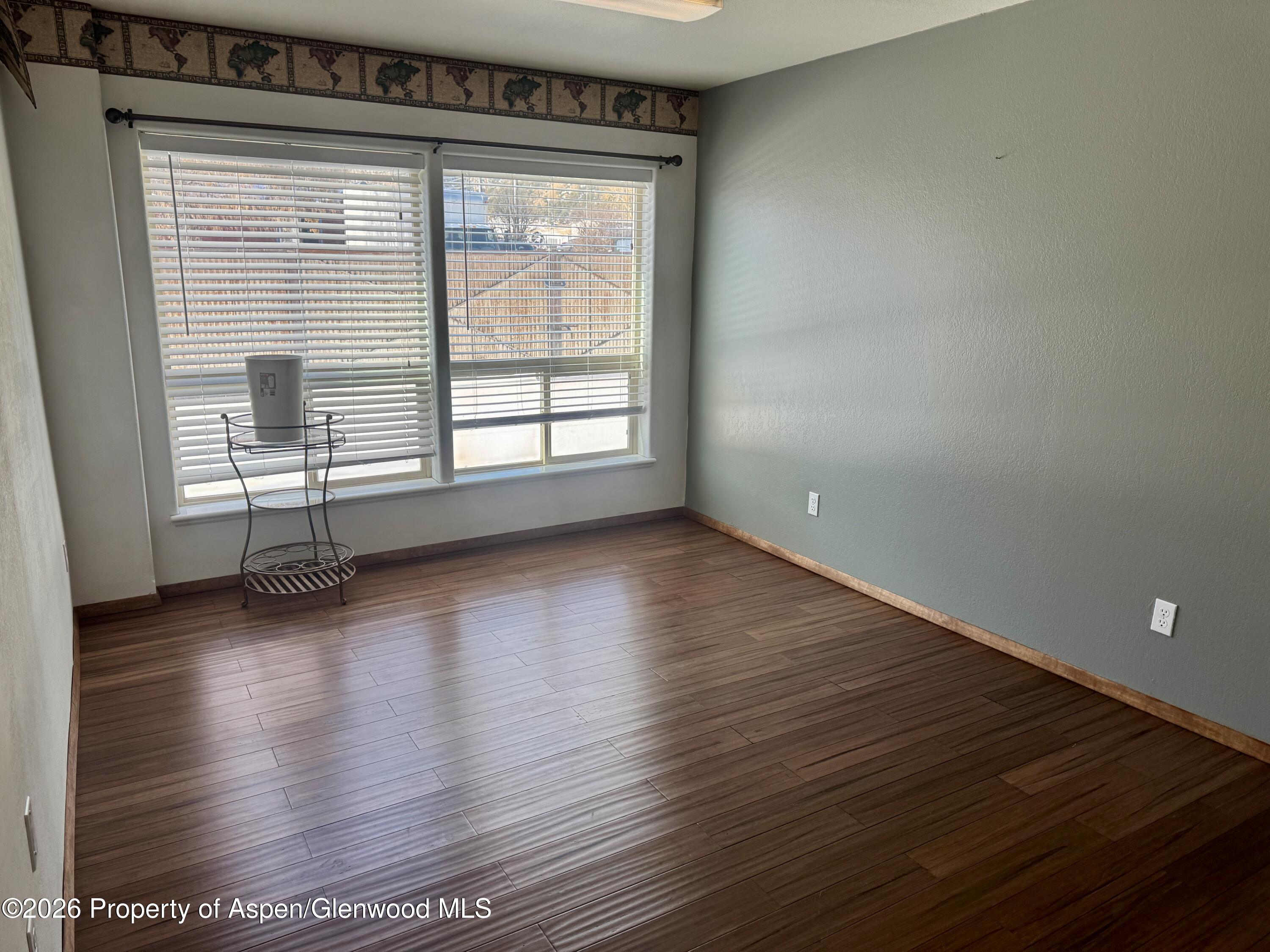 1287 Market Street Meeker, CO 81641 - Photo 11 of 44 wooden floor in an empty room with a window