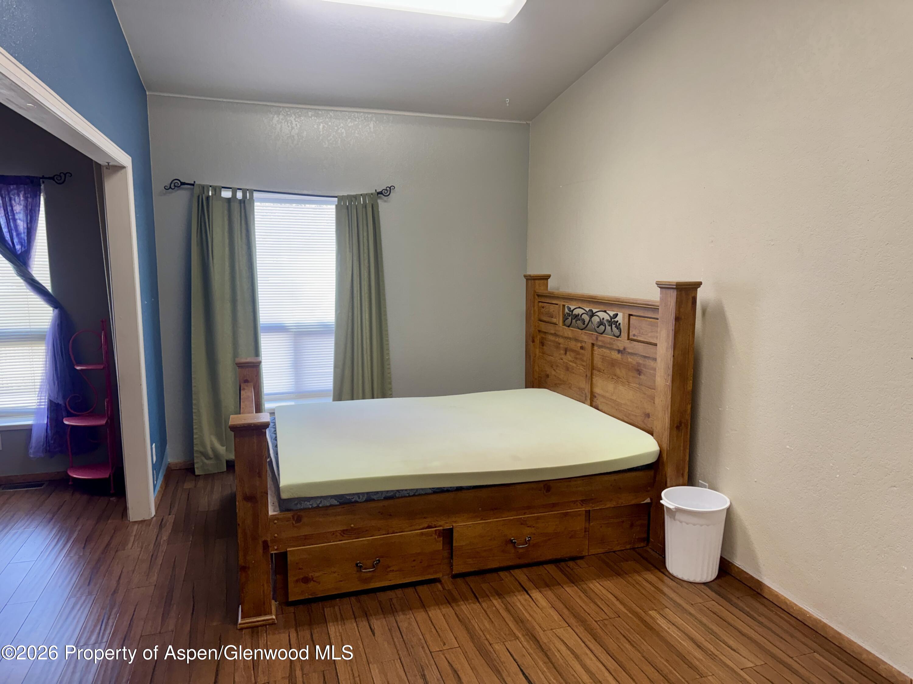 1287 Market Street Meeker, CO 81641 - Photo 12 of 44 a room with wooden floor and chair