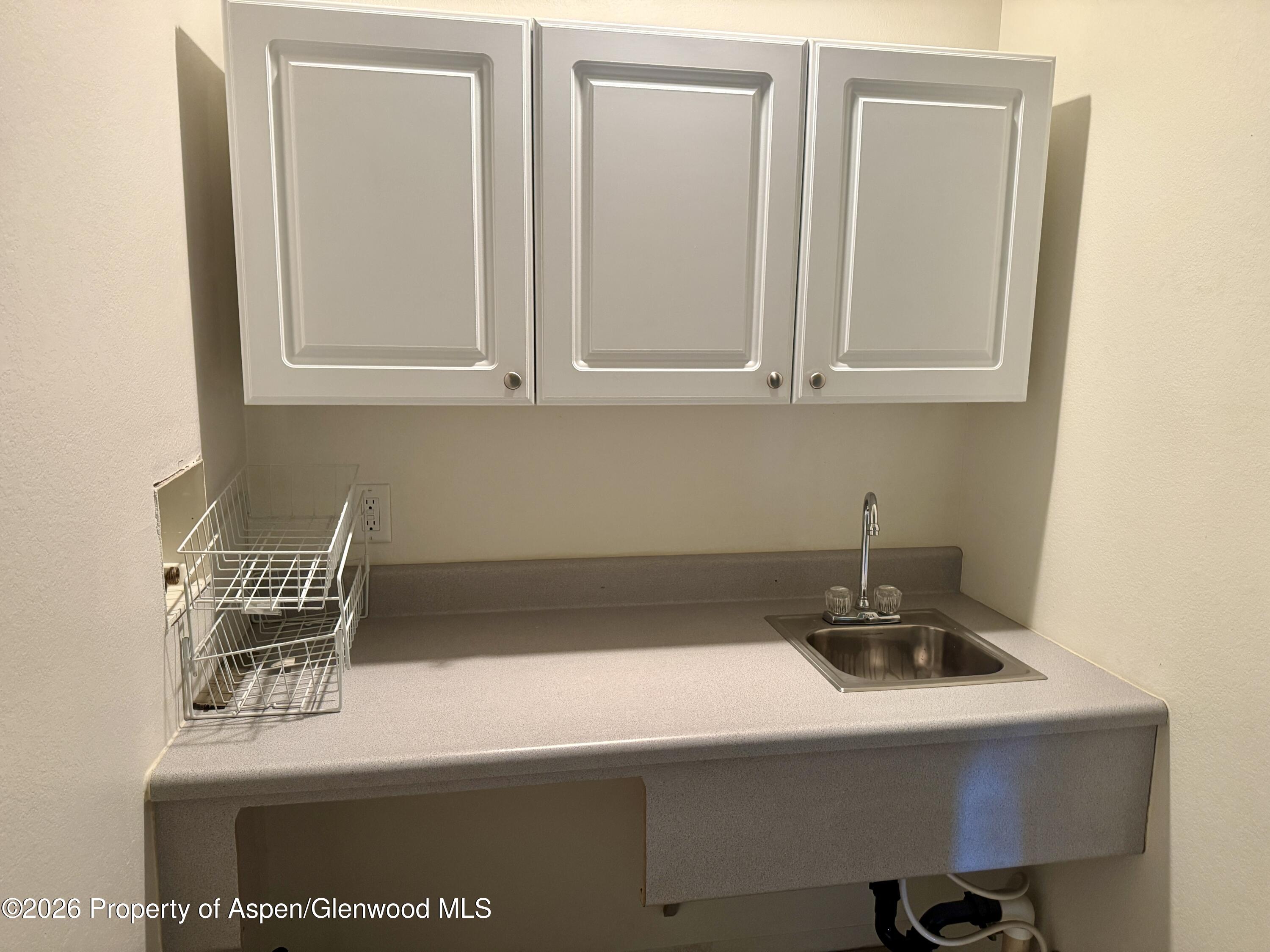1287 Market Street Meeker, CO 81641 - Photo 13 of 42 a kitchen with a sink and cabinets