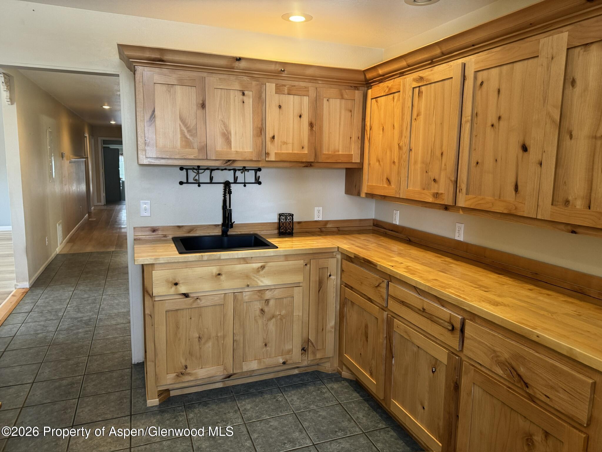 1287 Market Street Meeker, CO 81641 - Photo 16 of 44 a kitchen with stainless steel appliances granite countertop a sink a stove and cabinets