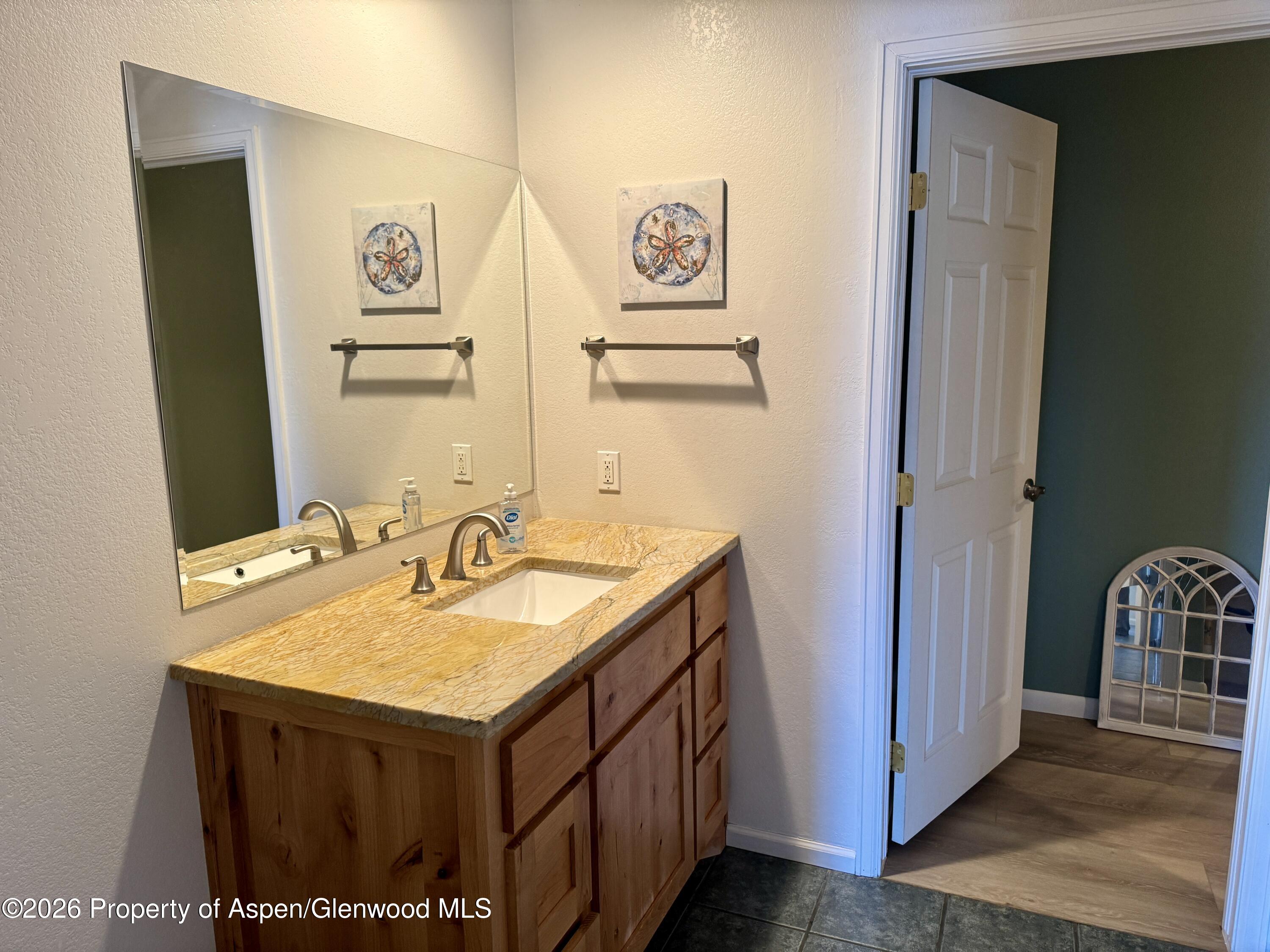 1287 Market Street Meeker, CO 81641 - Photo 17 of 42 a bathroom with a sink and a mirror