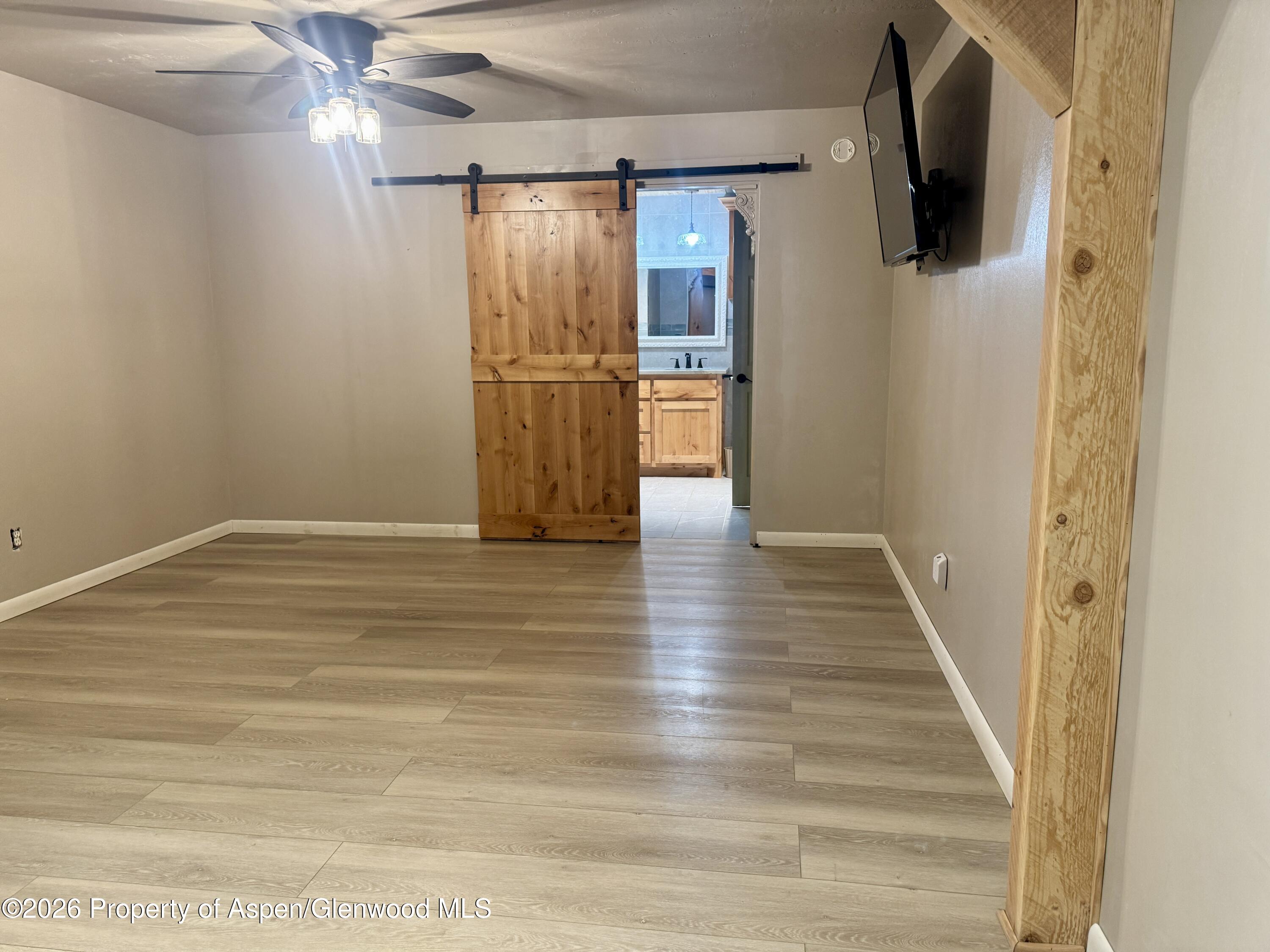 1287 Market Street Meeker, CO 81641 - Photo 19 of 42 a view of a hallway with wooden floor