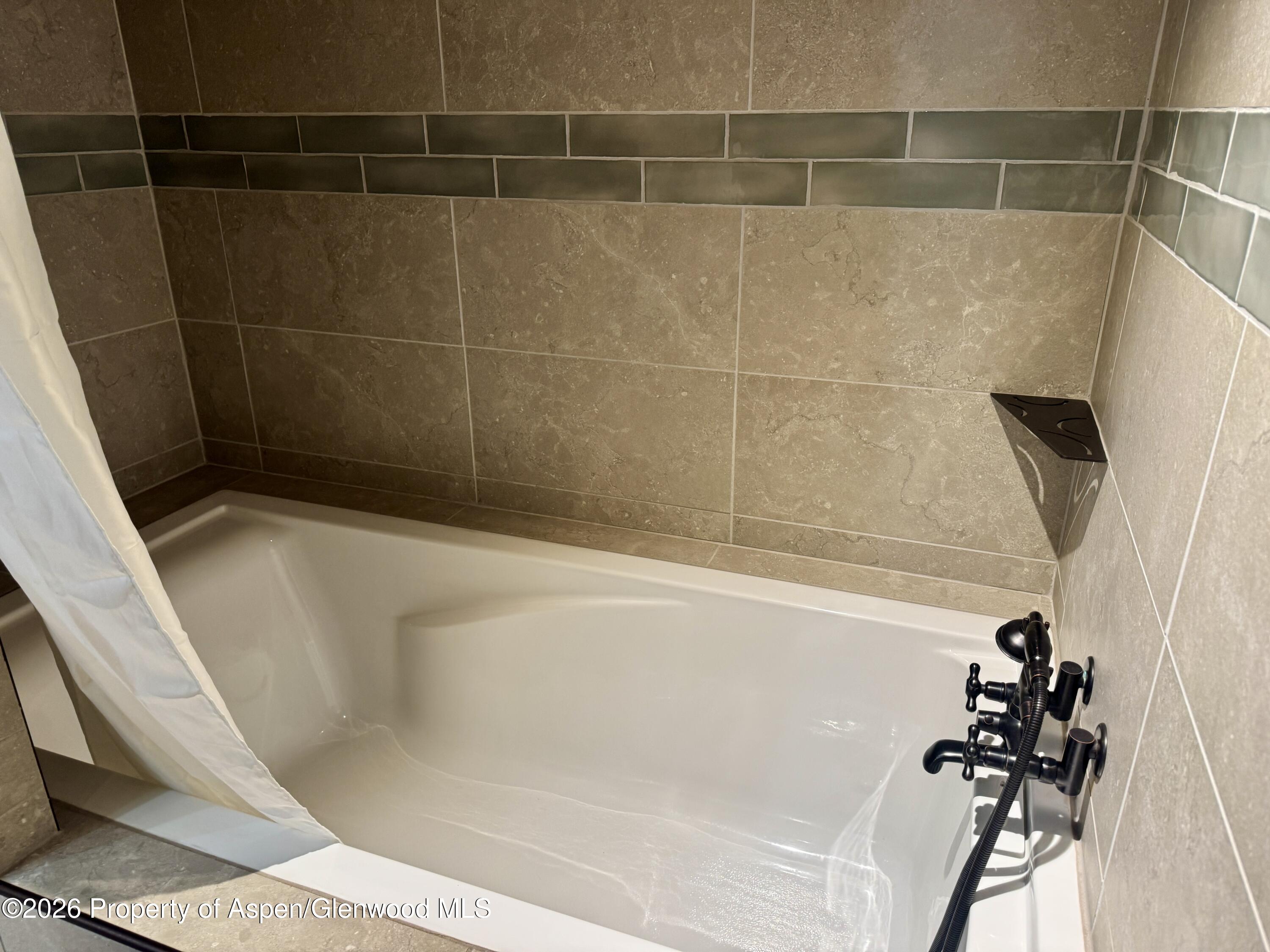 1287 Market Street Meeker, CO 81641 - Photo 22 of 42 a bathroom with a bathtub