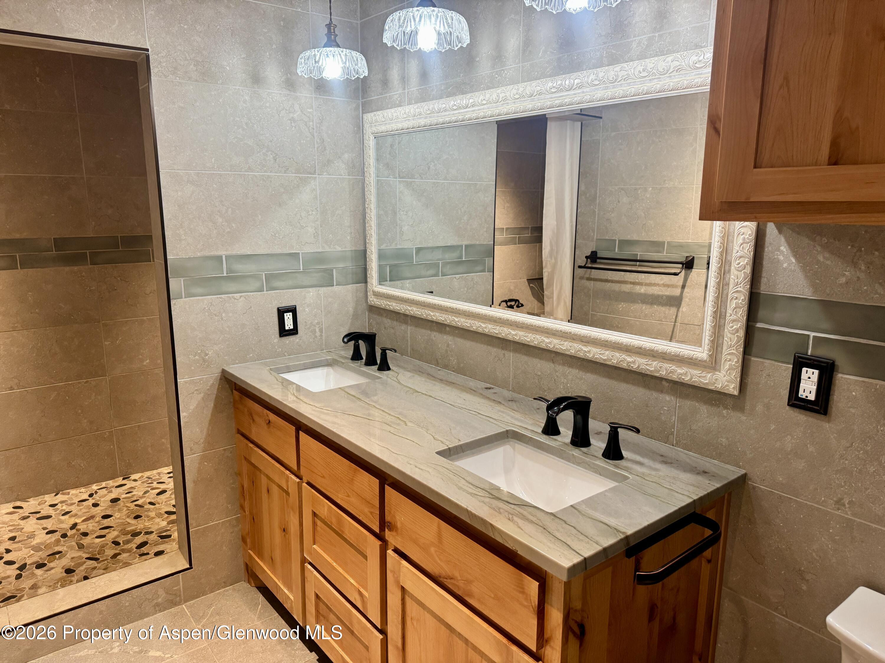 1287 Market Street Meeker, CO 81641 - Photo 23 of 44 a bathroom with a sink and a mirror
