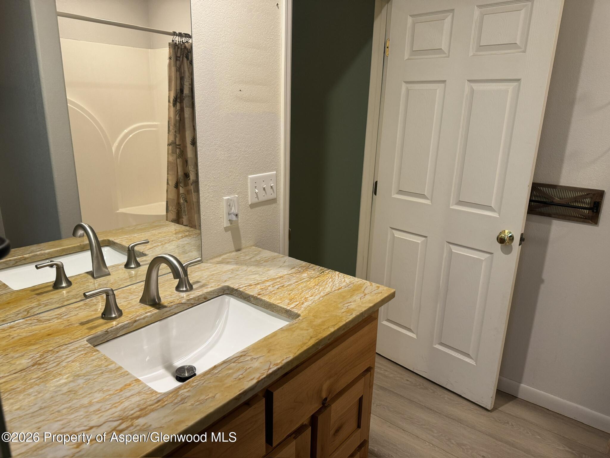 1287 Market Street Meeker, CO 81641 - Photo 26 of 44 a bathroom with a sink vanity and a mirror