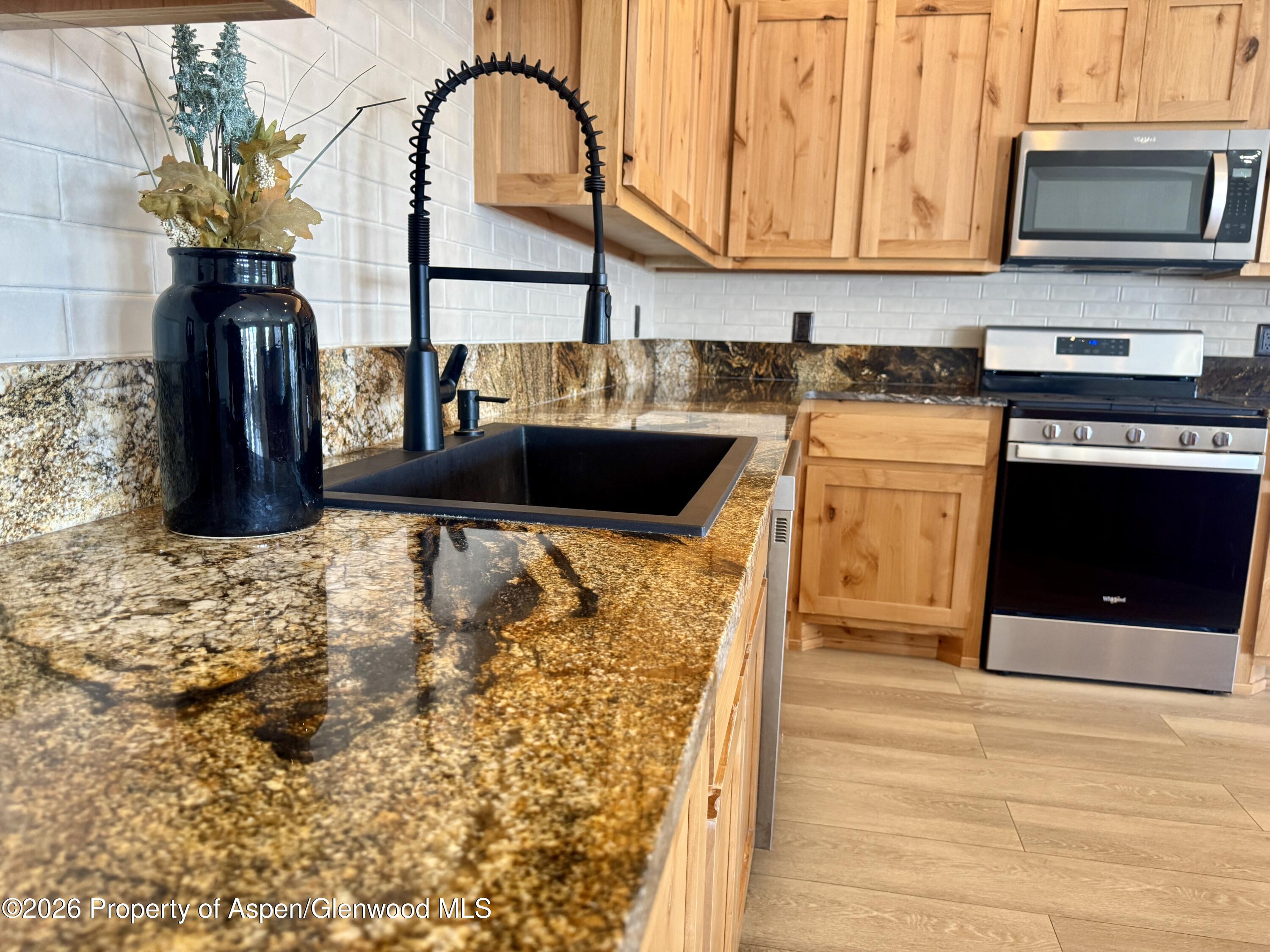 1287 Market Street Meeker, CO 81641 - Photo 3 of 42 a kitchen with a sink and a stove