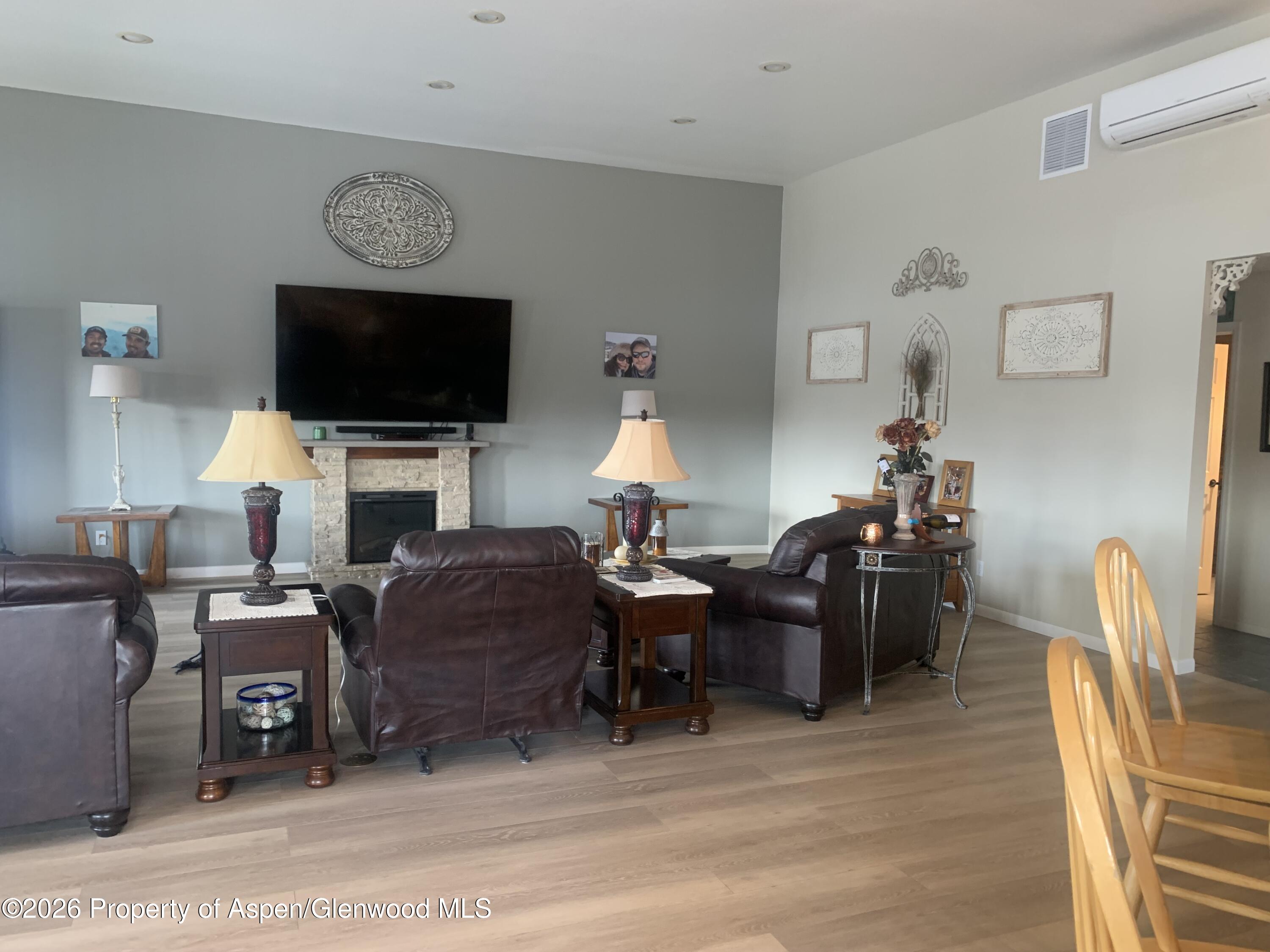 1287 Market Street Meeker, CO 81641 - Photo 7 of 44 a living room with furniture a flat screen tv and kitchen view