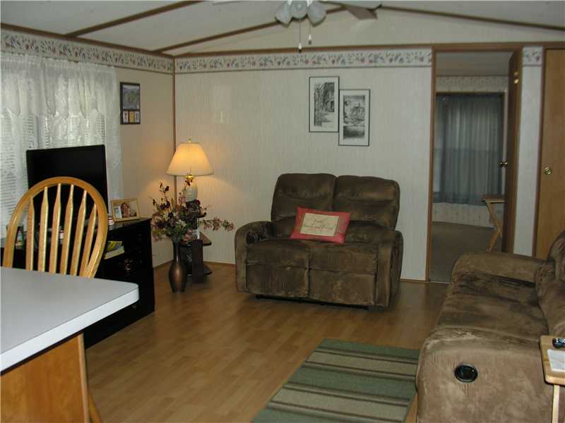 31 Woodward Road Lincoln, RI 02865 - Photo 2 of 8 Living Room. Lots of light in this living room.