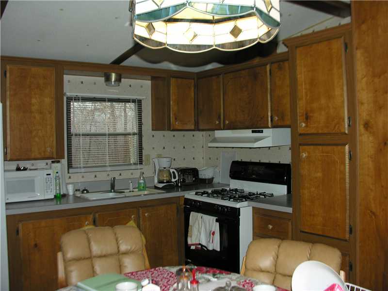 31 Woodward Road Lincoln, RI 02865 - Photo 4 of 8 Kitchen. Eat in kitchen with room for a dining table and chairs. Lots of storage cupboards.
