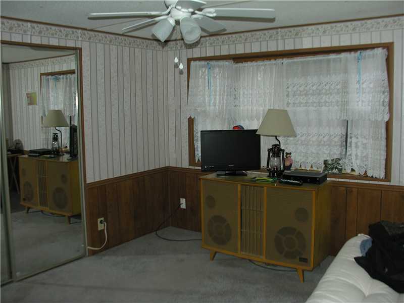 31 Woodward Road Lincoln, RI 02865 - Photo 6 of 8 Bedroom. Second bedroom with mirrored closets and another bay window.