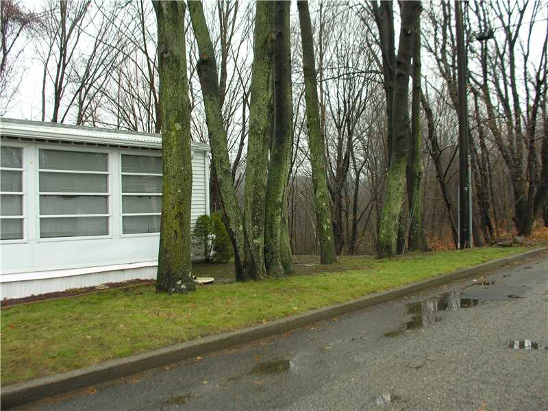 31 Woodward Road Lincoln, RI 02865 - Photo 8 of 8 Exterior Front. Wooded lot adds privacy and beautiful rural atmosphere.