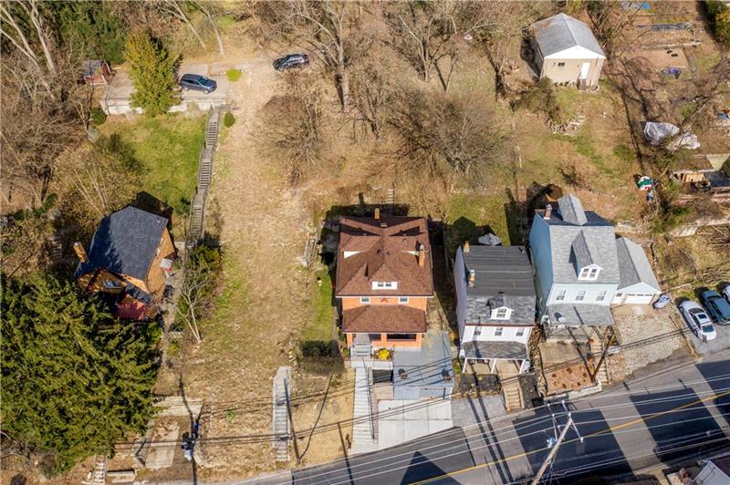 127 Friday Road Pittsburgh, PA 15209 - Photo 20 of 20 The rear of the house can be accessed from the road behind. Additional parking could be made, there is currently a staircase that leads to the back roadway.